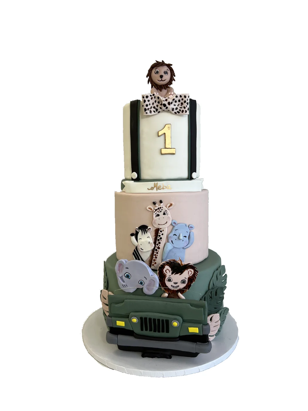 Three-tier safari birthday cake with a lion, giraffe and jeep
