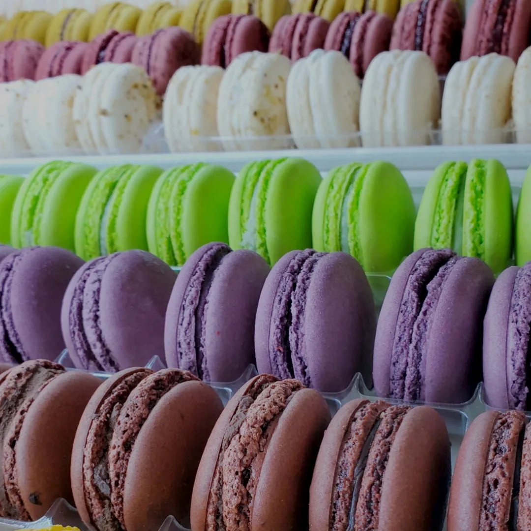 Rows of French macarons in the case