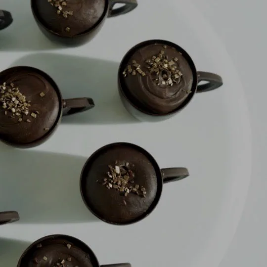 Chocolate mousse cups in dark cups