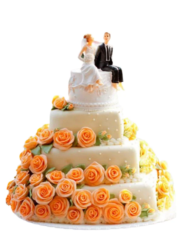 Wedding cake with peach roses and a bride and groom topper